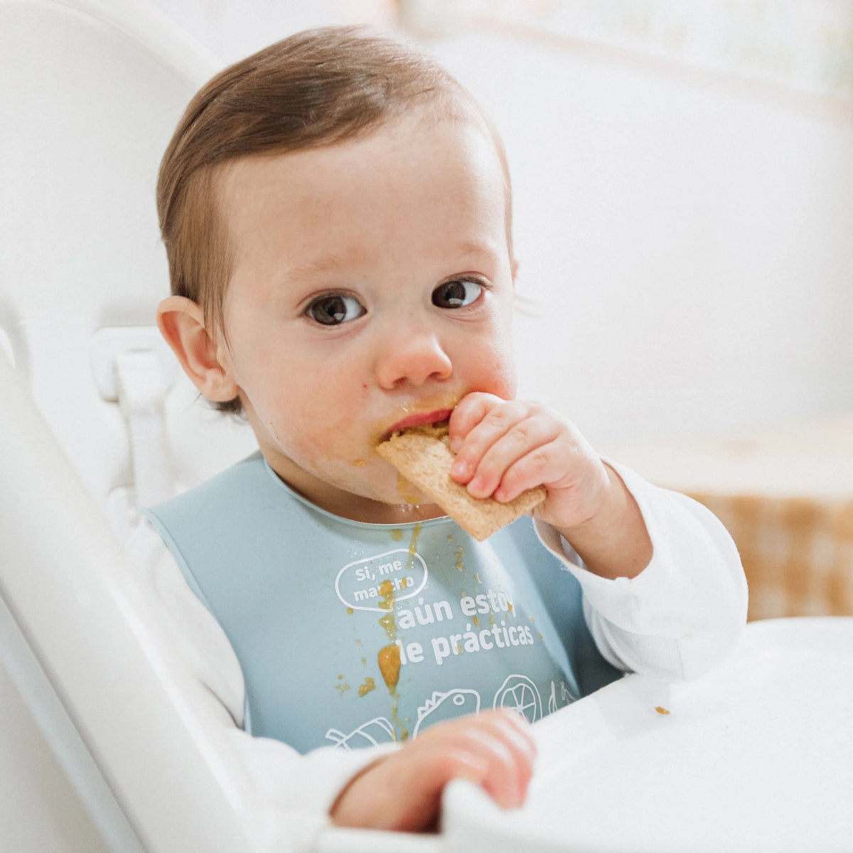 baby eating smileat multigrain muffins