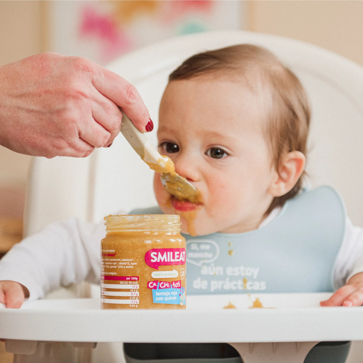 Baby Eating Lentil Jar with Quinoa