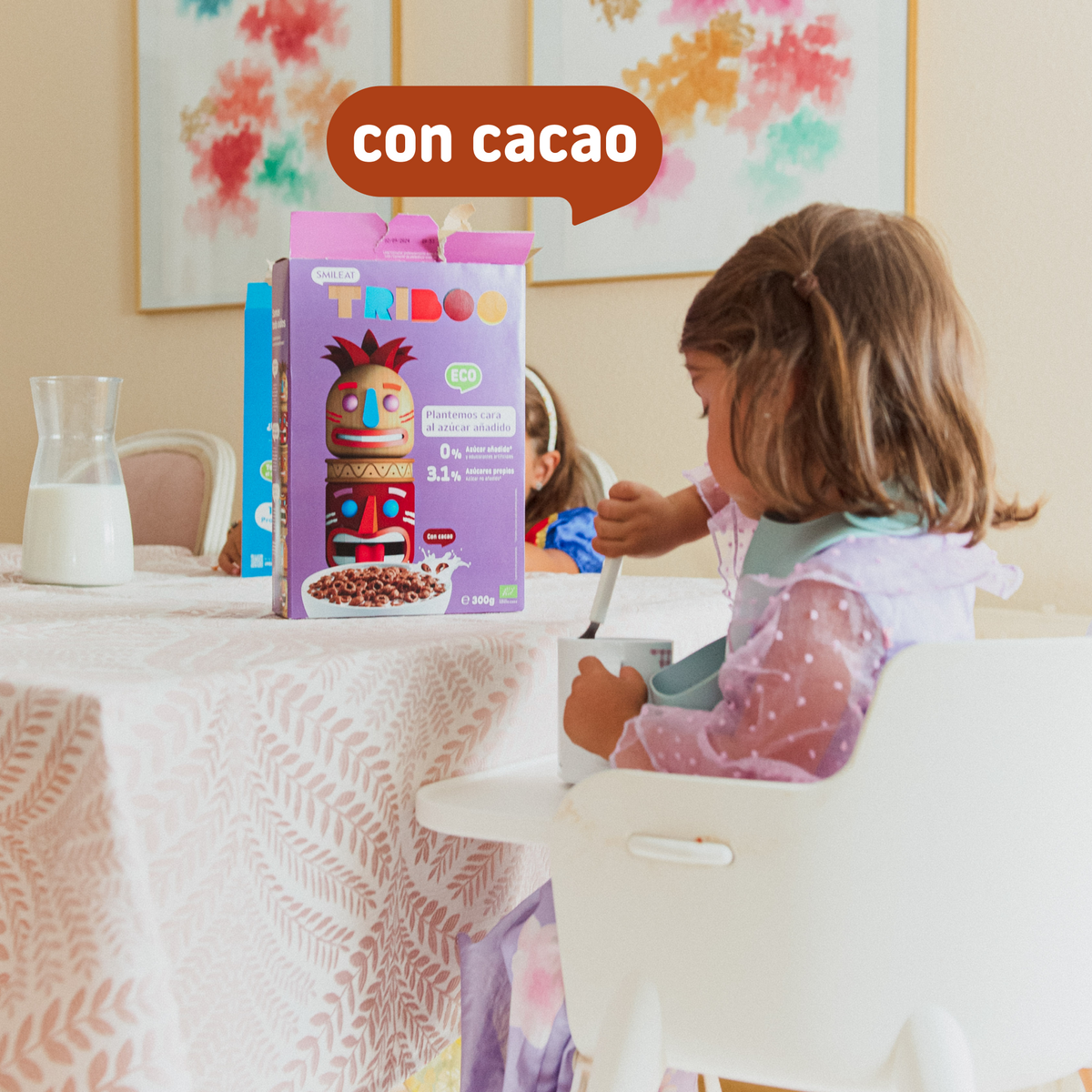 child eating TRIBOO cereal with cocoa